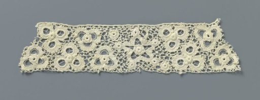 Strip of crocheted lace with five-pointed stars and flowers made with open circles