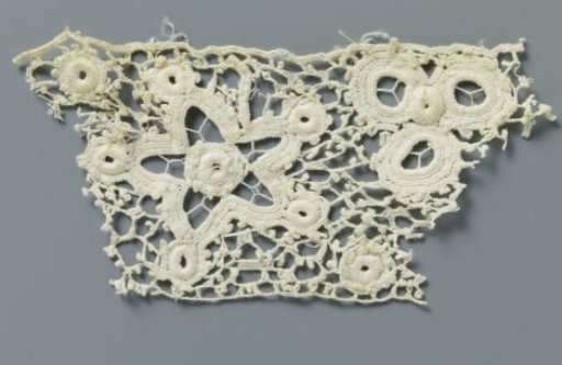 Strip of crocheted lace with five-pointed stars and flowers made with open circles