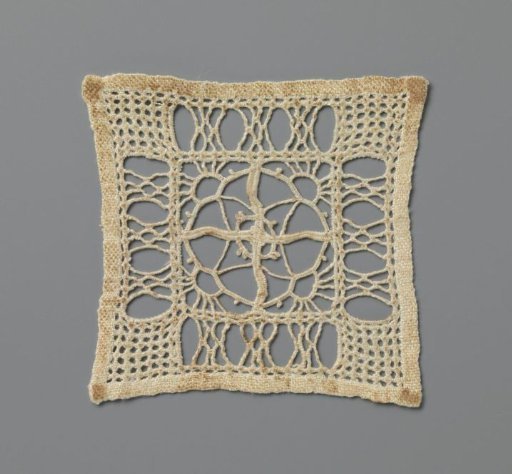 Lace garment with rising suns in a diamond pattern