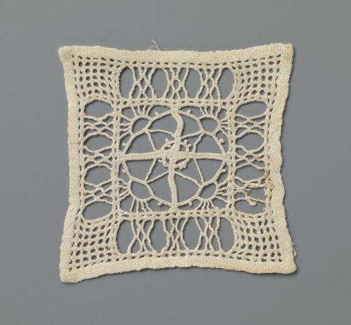 Lace garment with rising suns in a diamond pattern