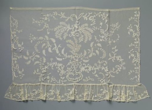 Strip of appliqué lace with mimosa sprigs