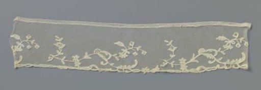 Strip of appliqué lace with small bird branches