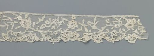 Japanese strip of appliqué lace with symmetrical reserves along the lower edge