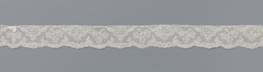Strip of bobbin lace with mountain and valley line