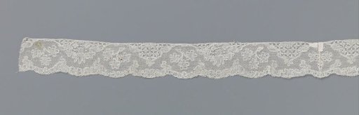 Strip of bobbin lace with mountain and valley line