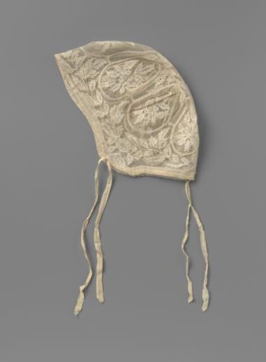 Cap of lace embroidery on tulle with flower sprigs