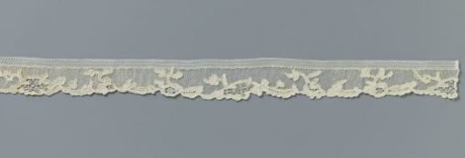 Strip of needle lace with openwork medallions