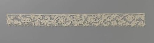 Strip of needle lace with elongated S-scroll