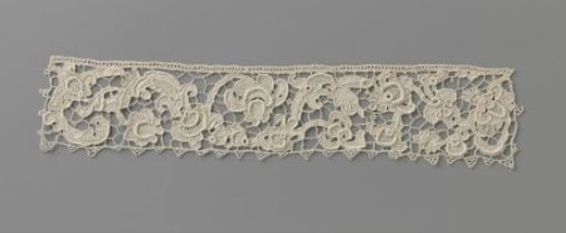 Strip of needle lace with elongated S-scroll