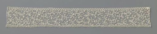 Strip of needle lace with sparse spiral vines
