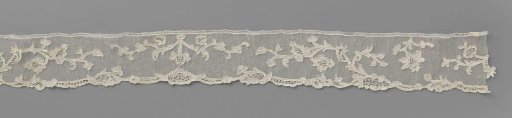 Strip of needle lace with hanging flowers