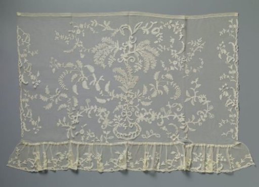 Japanese ornamentation of appliqué lace with mimosa sprigs