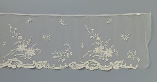 Strip of appliqué lace with daisy branches