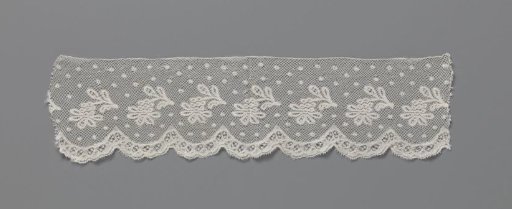 Strip of bobbin lace with curved branches