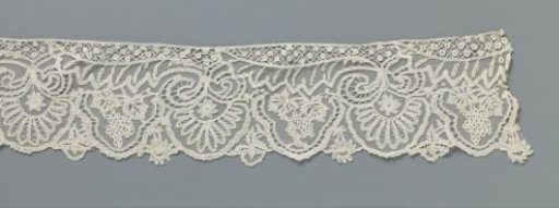 Strip of appliqué lace with grape clusters and halved leaves