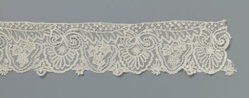 Strip of appliqué lace with grape clusters and halved leaves