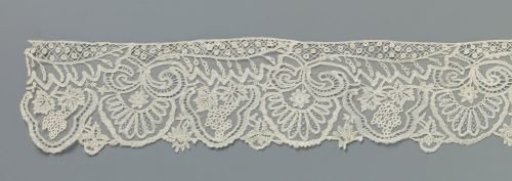 Strip of appliqué lace with grape clusters and halved leaves