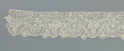 Strip of appliqué lace with grape clusters and halved leaves