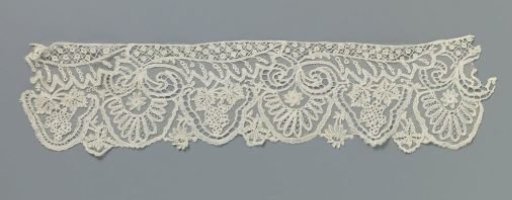 Strip of appliqué lace with grape clusters and halved leaves