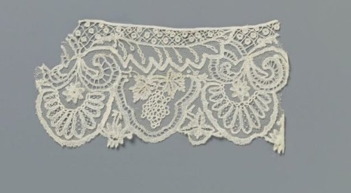 Strip of appliqué lace with grape clusters and halved leaves