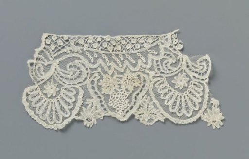 Strip of appliqué lace with grape clusters and halved leaves