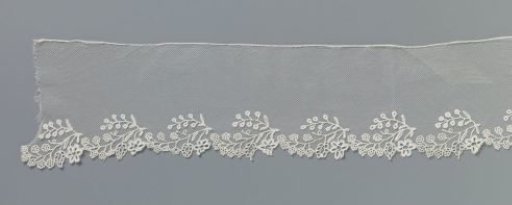 Strip of appliqué lace with blossom branches