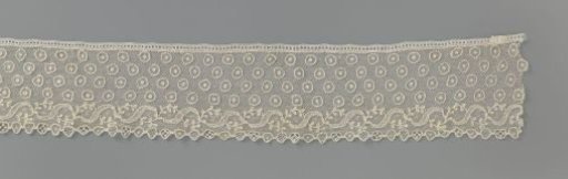 Strip of needle lace with eyelet pattern