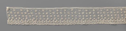 Strip of needle lace with various leaves