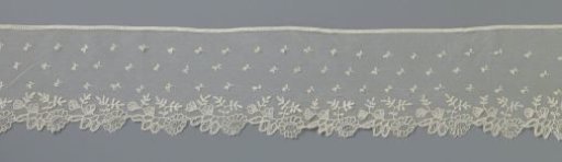 Strip of appliqué lace with à-jour flower and leaf branch