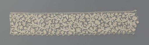 Strip of needle lace with plumed vines