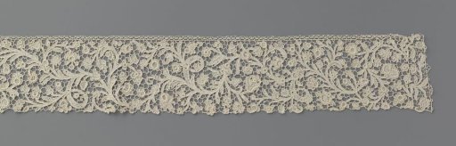 Strip of needle lace with feathered vines