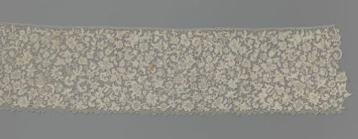 Strip of needle lace with feather motif