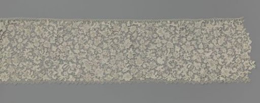 Strip of needle lace with feather motif