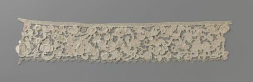 Strip of needle lace with snail shell