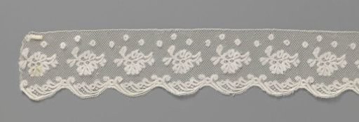 Strip of bobbin lace with anemones