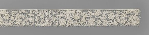 Strip of needle lace with split spirals
