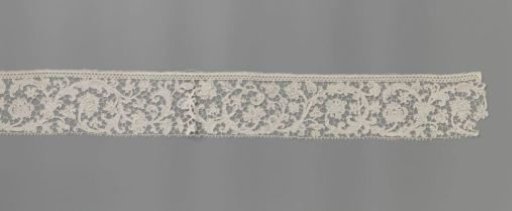 Strip of needle lace with volute tendrils