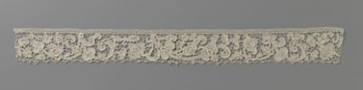 Strip of machine-made lace with double vines