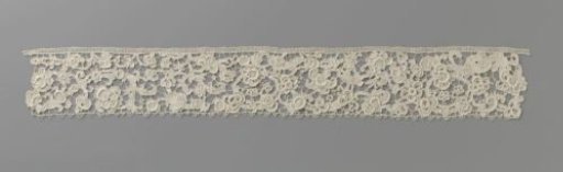 Strip of needle lace with split spirals