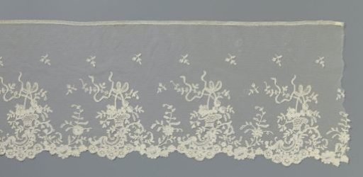 Flounce of appliqué lace with a flower basket