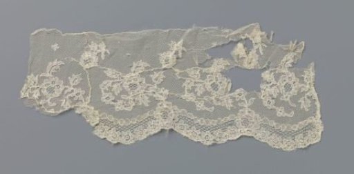 Strip of bobbin lace with pearl and rosette border