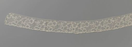 Strip of bobbin lace with rocailles