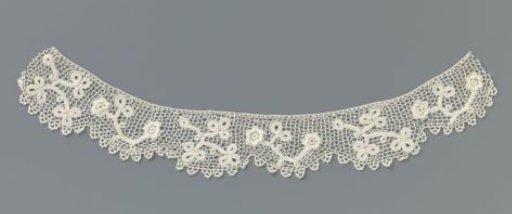 Collar of crocheted lace with loose stems and a layered rosette flower on each side