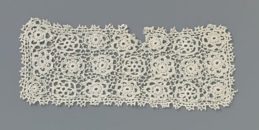 Cuff of crocheted lace with three rows of flat rosette flowers