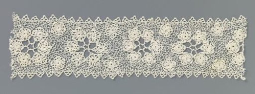 Strip of crocheted lace with a wreath of rosettes