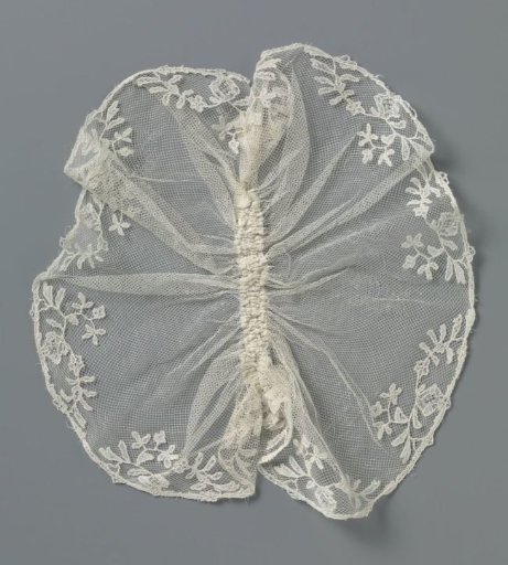 Jabot of applied lace with a border of small flower sprigs