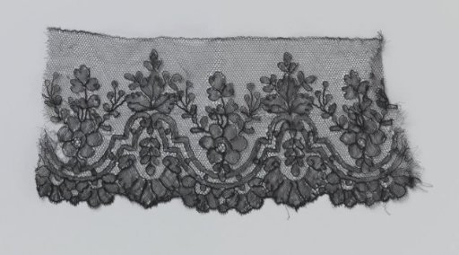 Strip of bobbin lace with hollow and solid double borders