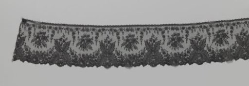 Japanese strip of bobbin lace with ferns
