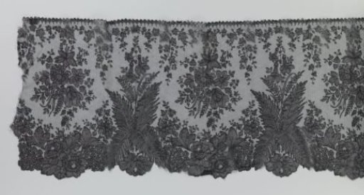 Japanese border strip of bobbin lace with ferns