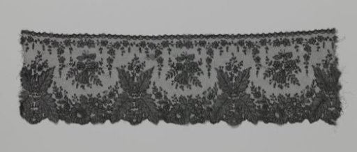 Japanese border strip of bobbin lace with ferns
